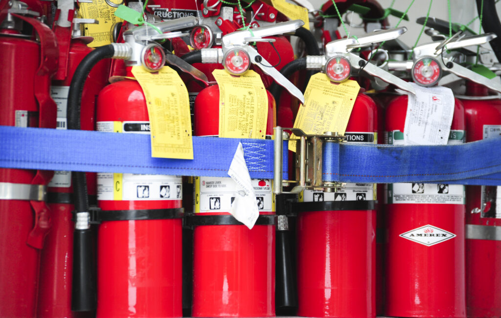 Fire Extinguishers in a row, tagged and secured.