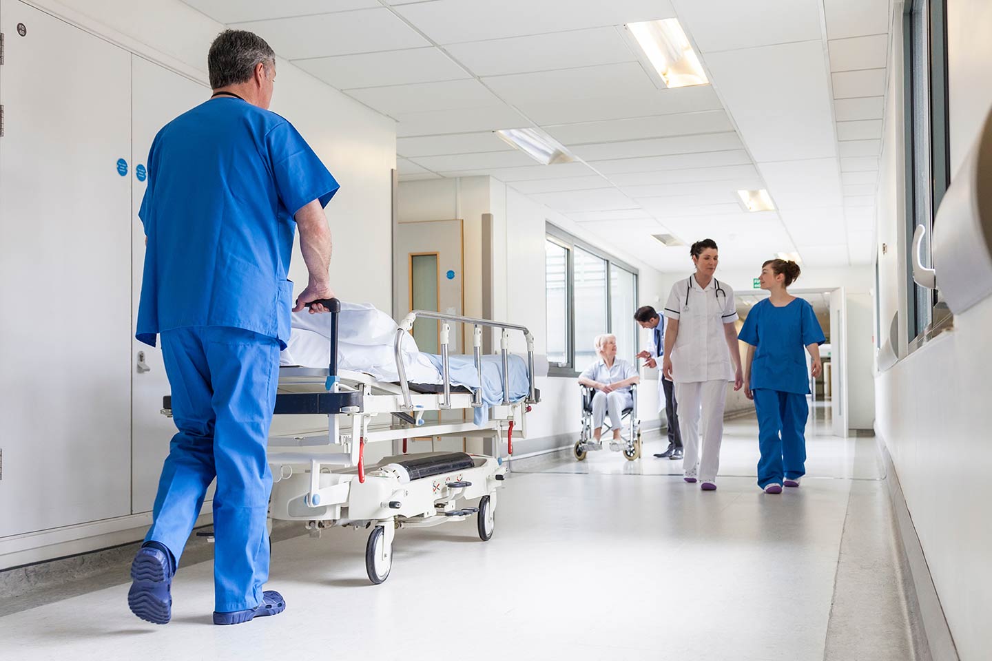 Hospital hallway with healthcare staff walking